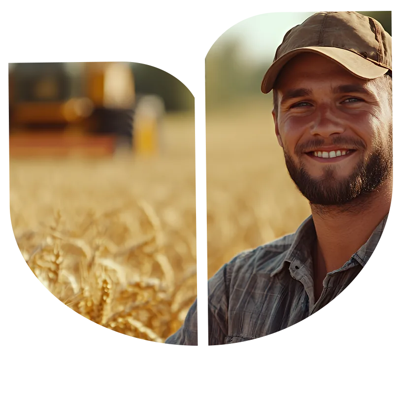 Produtor rural sorrindo em uma lavoura de trigo